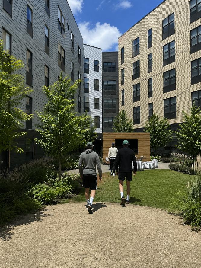 Friends walking through the courtyard at The Marshall Binghamton